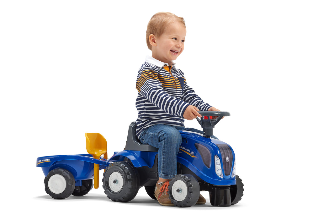 Lauftraktor New Holland mit Anhänger Schaufel und Rechen