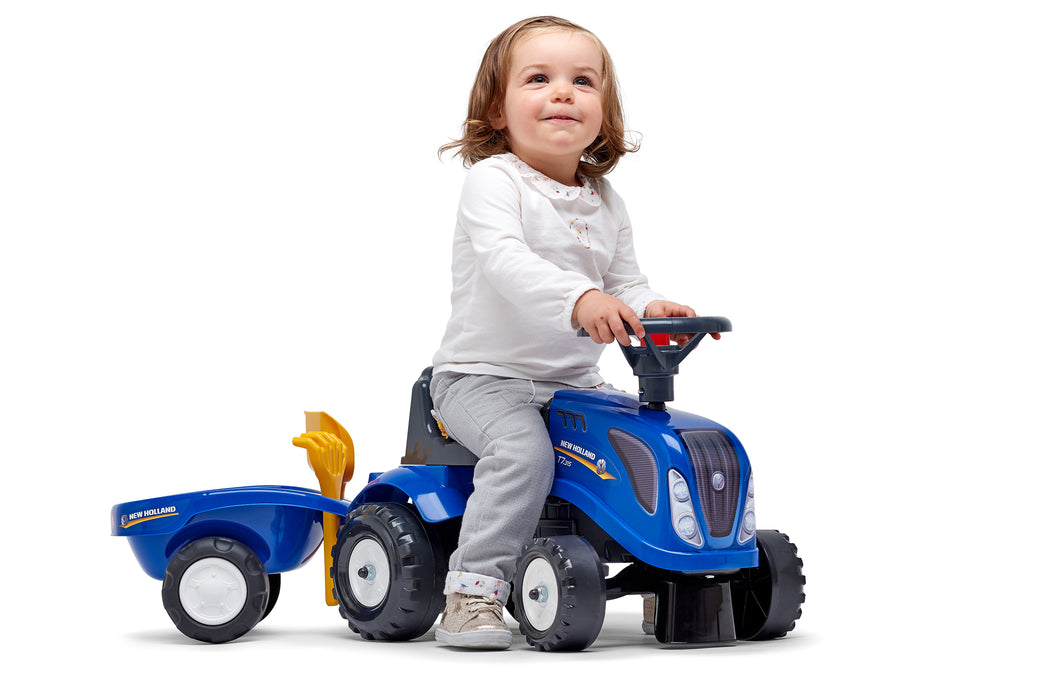 Lauftraktor New Holland mit Anhänger Schaufel und Rechen