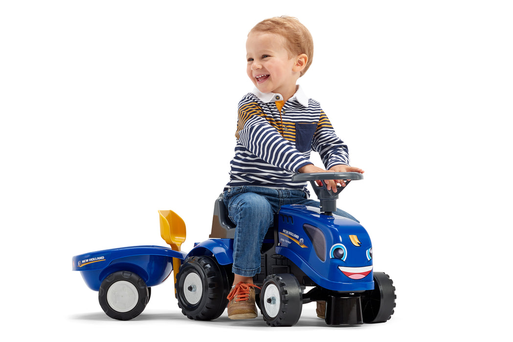 Lauftraktor New Holland mit Anhänger Schaufel und Rechen