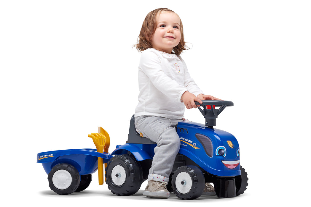Lauftraktor New Holland mit Anhänger Schaufel und Rechen