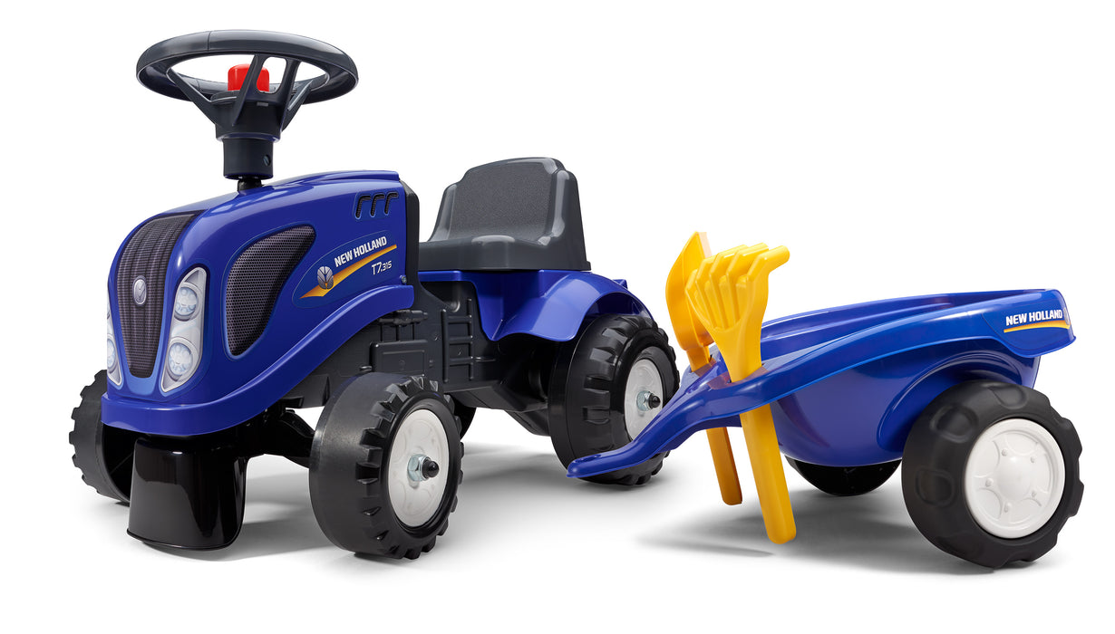 Lauftraktor New Holland mit Anhänger Schaufel und Rechen